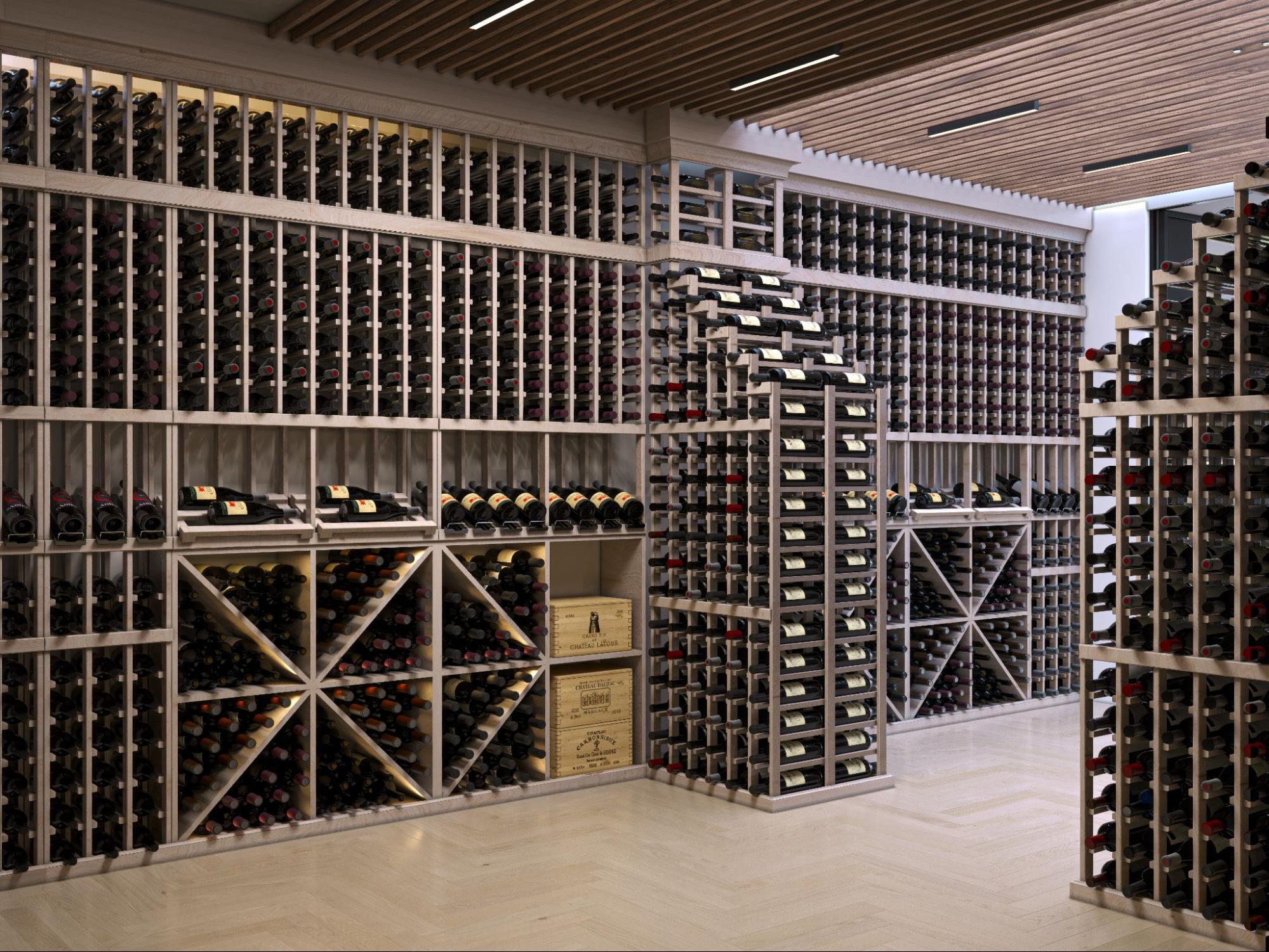 Wine cellar with dark wood racks, diamond bins, angled bottle displays, and a central tasting island with bottle storage