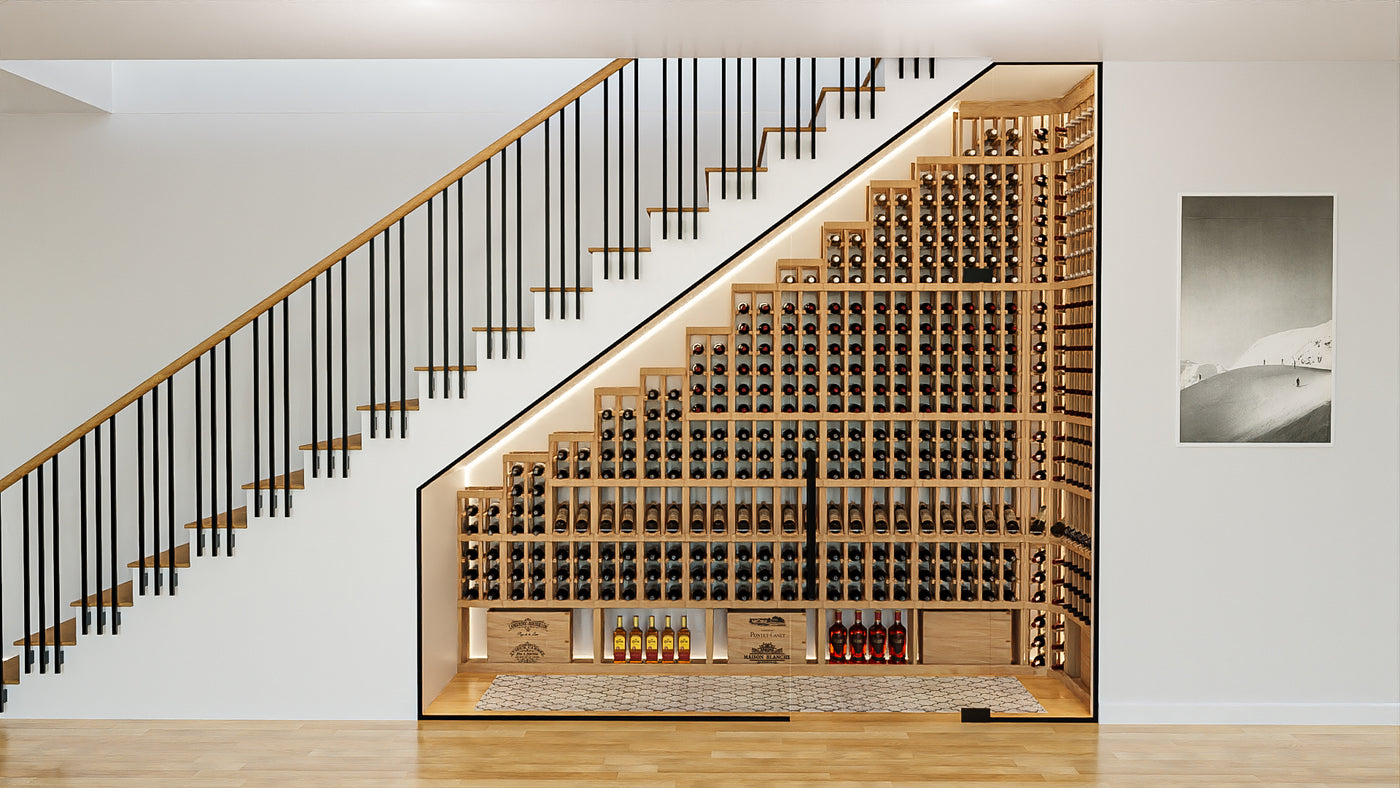 Wine cellar under a staircase with wooden racks and bottles.