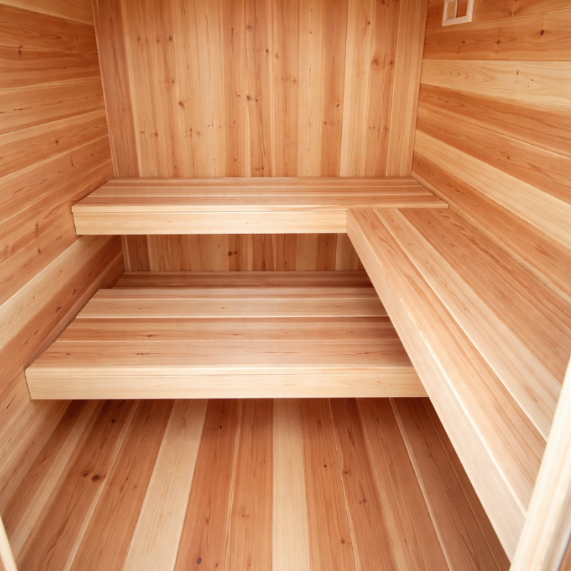 Wooden sauna interior with benches and walls.